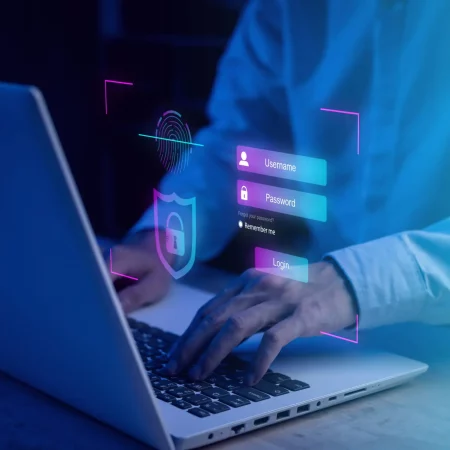 Username and password (Login) with biometric identification fing Username and password (Login) with biometric identification fingerprint scanner, encryption for technology cyber security internet and networking system. Businessman hand typing notebook (Laptop).